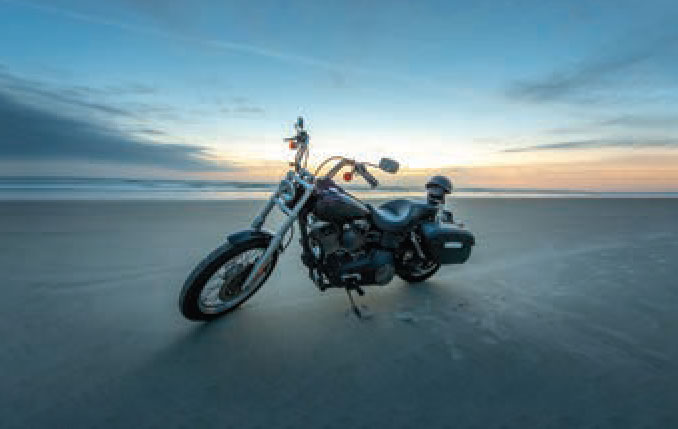 Stock photo of motorcycle on beach